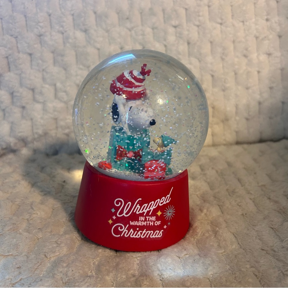 Red Snoopy Christmas Snow Globe with Woodstock the Bird.